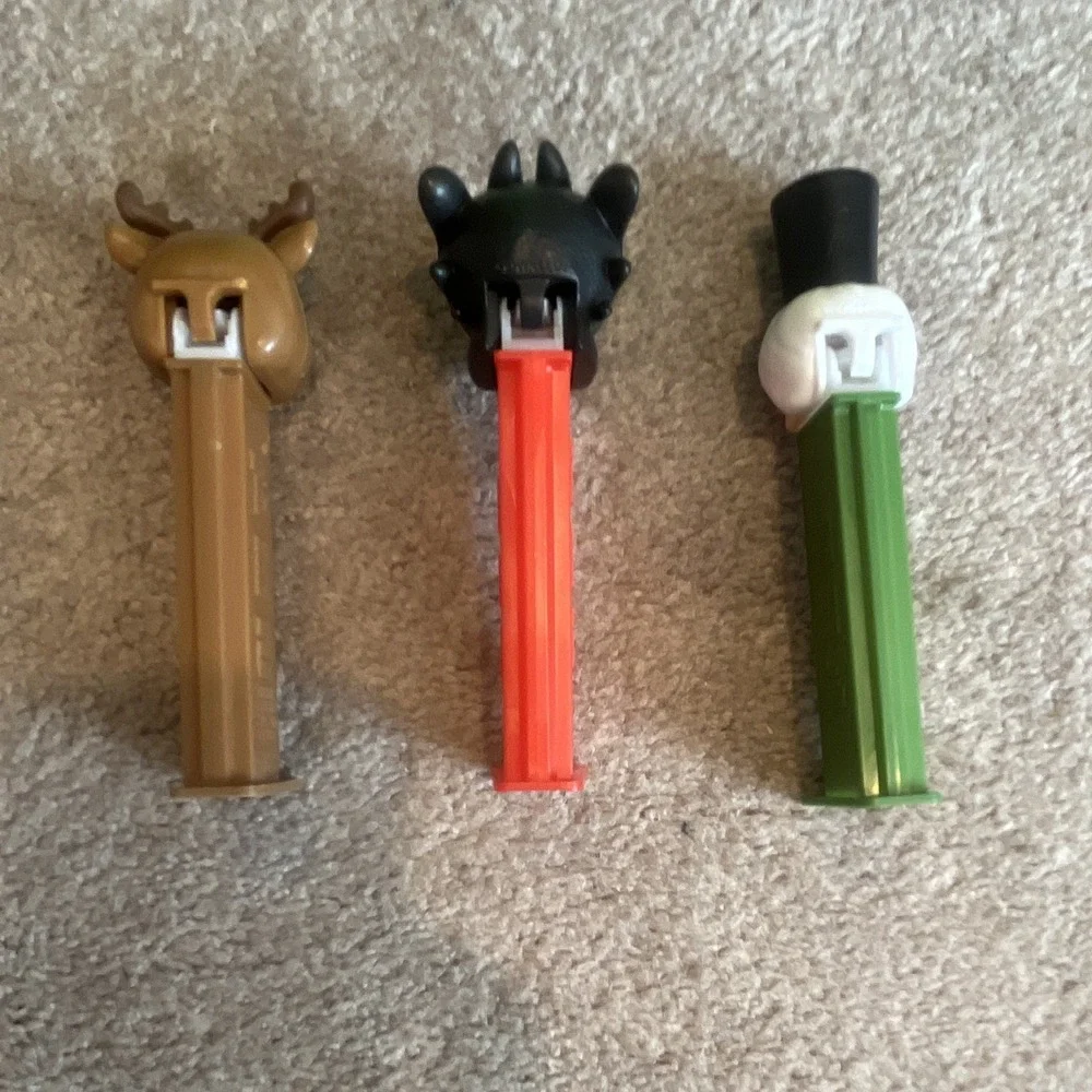 Lot of 3 PEZ Candy Dispensers: Reindeer, Black Beast/Monster & Nutcracker